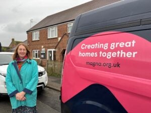 Belinda stood next to a Magna van in Charmouth