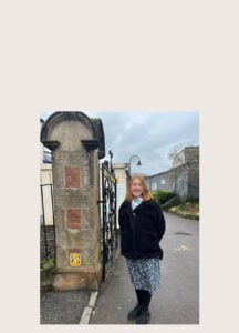 Belinda stood next to the new bus stop.